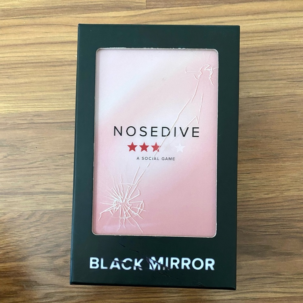 Nosedive card game based on Black Mirror TV Show.
New in box.